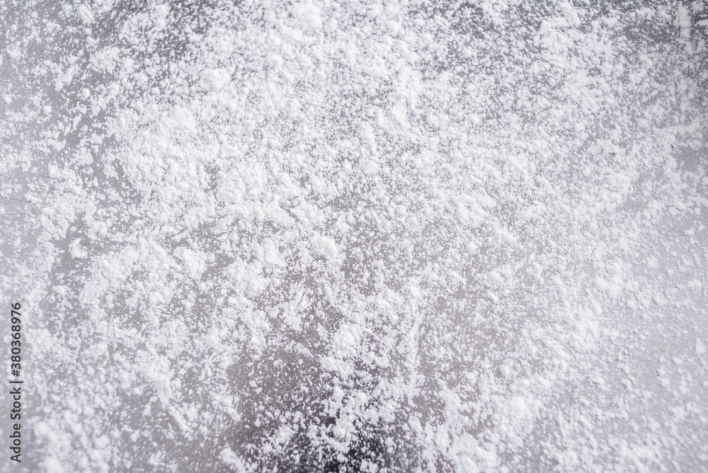 Sprinkle flour on stainless steel chopping board