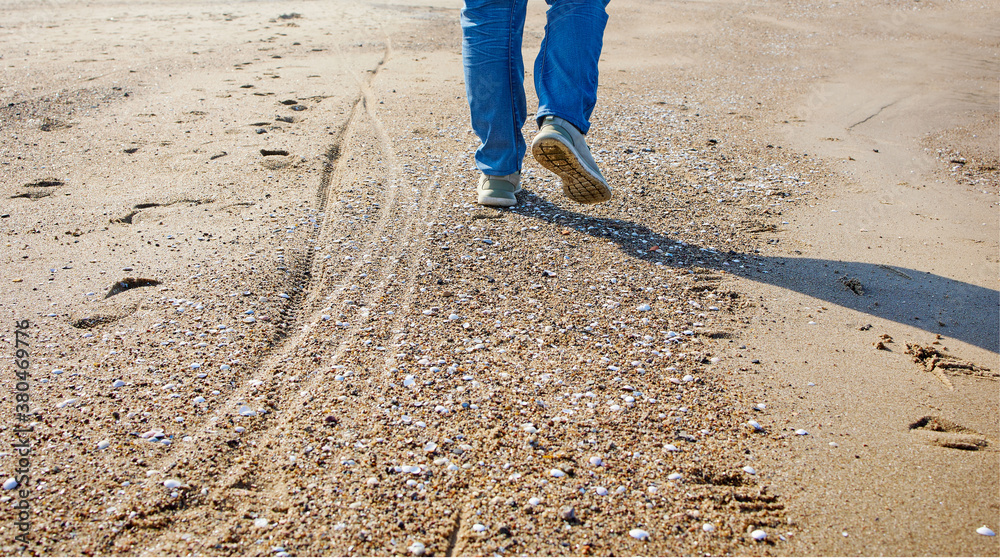 man walking on the beach