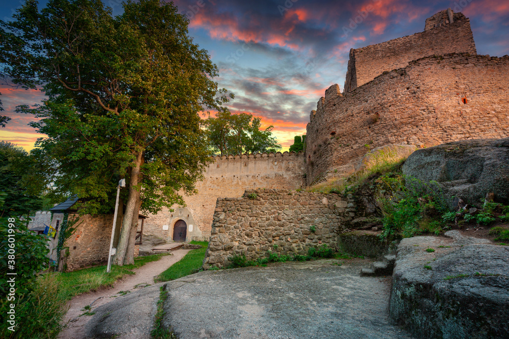 Ruins of Chojnik Castle in Karkonosze mountains at sunset. Poland