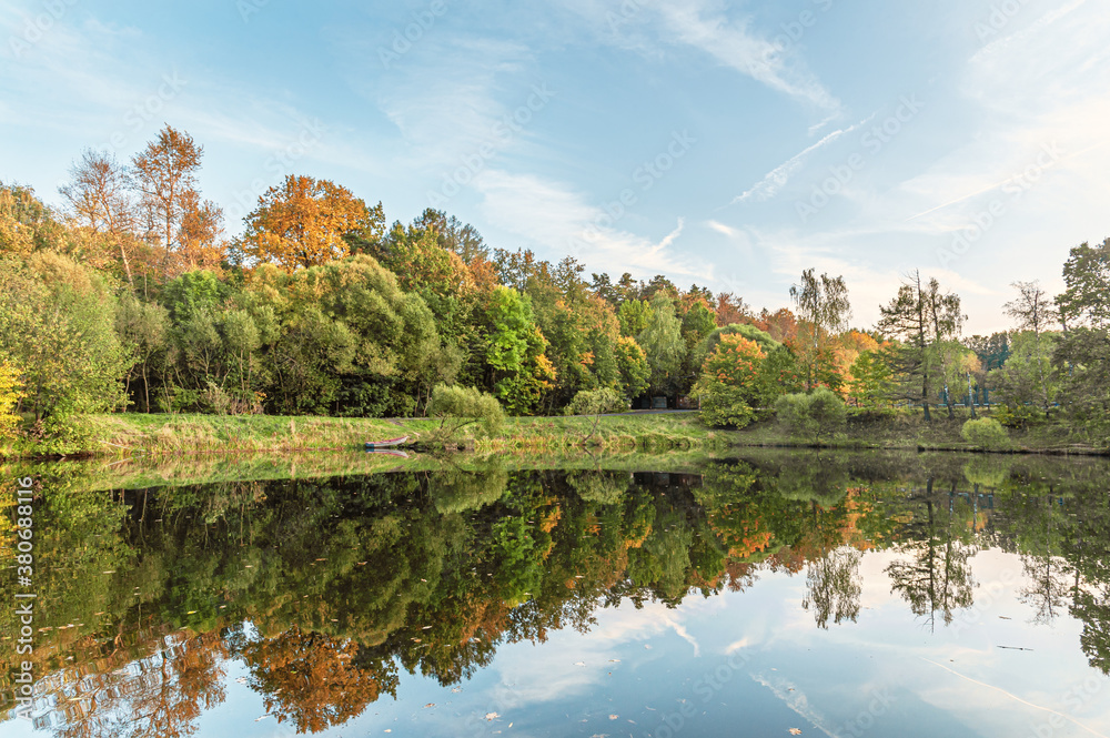 landscape of golden autumn at a forest lake