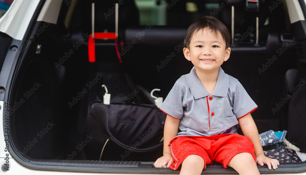 Back to School Concept.Happy Funny little asian boy raising hands thumb up and very excited and glad