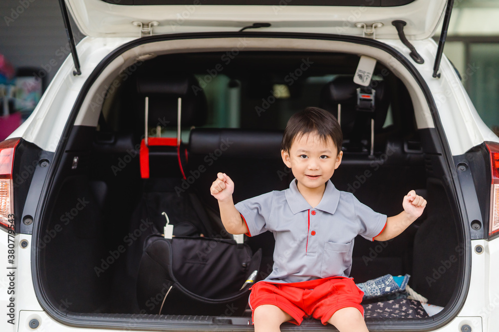 Back to School Concept.Happy Funny little asian boy raising hands thumb up and very excited and glad