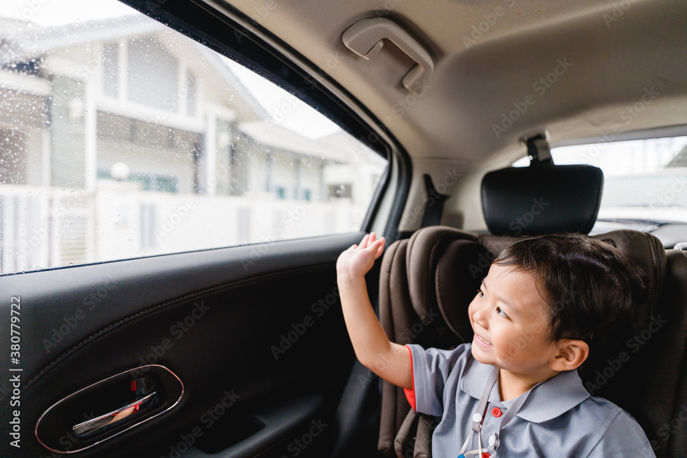 Back to School Concept.Happy Funny little asian boy raising hands thumb up and very excited and glad