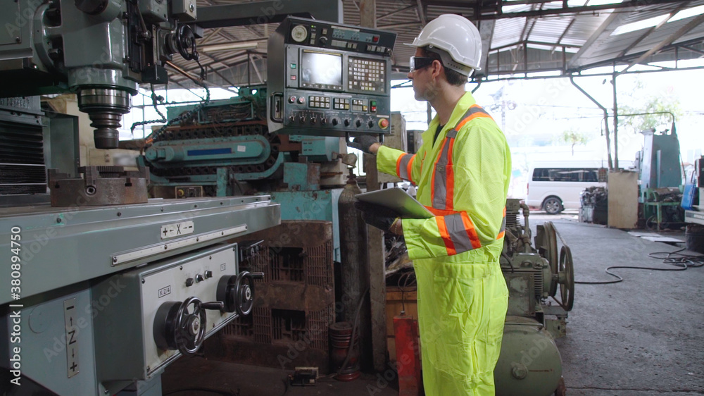 Smart factory worker using machine in factory workshop . Industry and engineering concept.