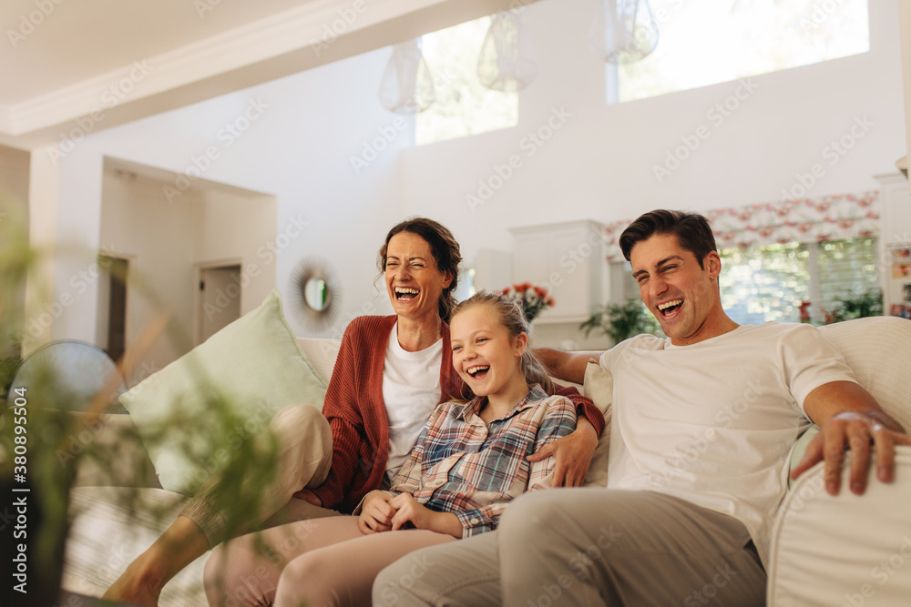 Family watching comedy tv show