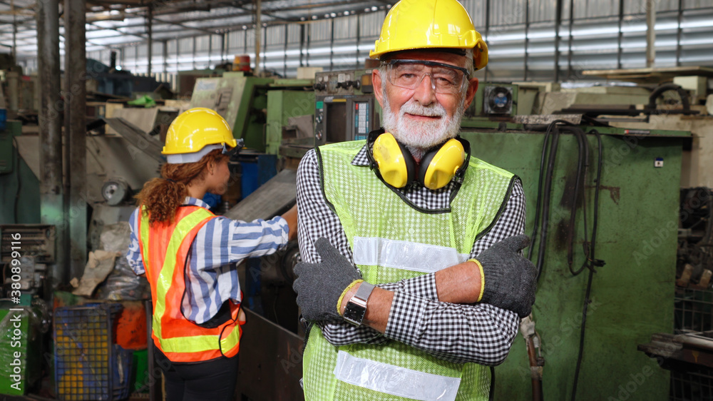 Senior factory worker or engineer close up portrait in factory . Industry and engineering concept .