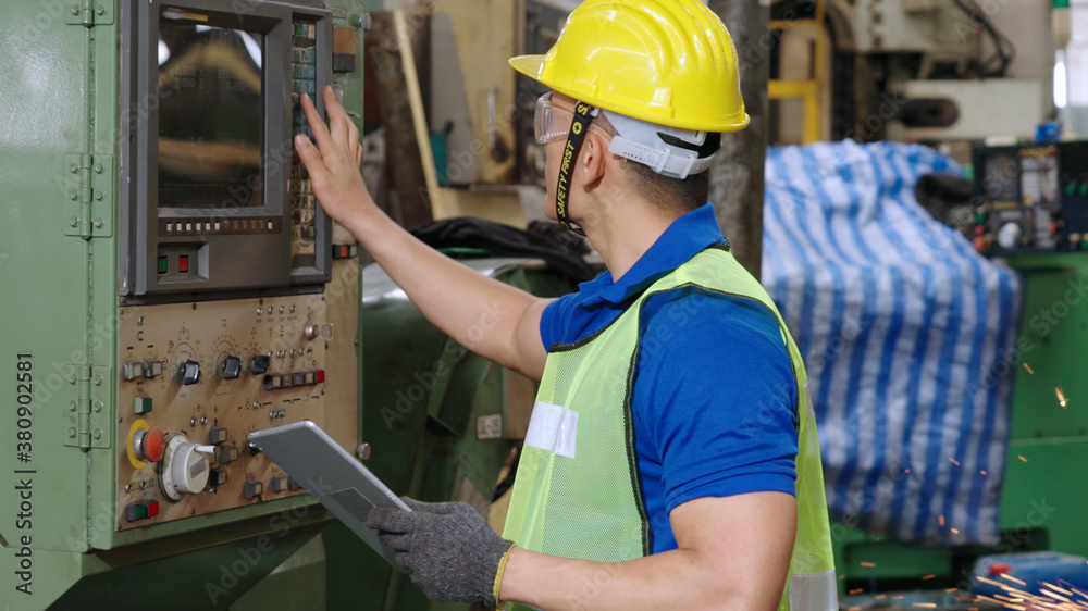 Smart factory worker using machine in factory workshop . Industry and engineering concept.