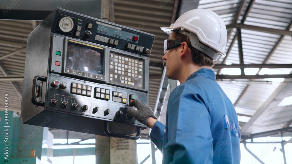 Smart factory worker using machine in factory workshop . Industry and engineering concept.