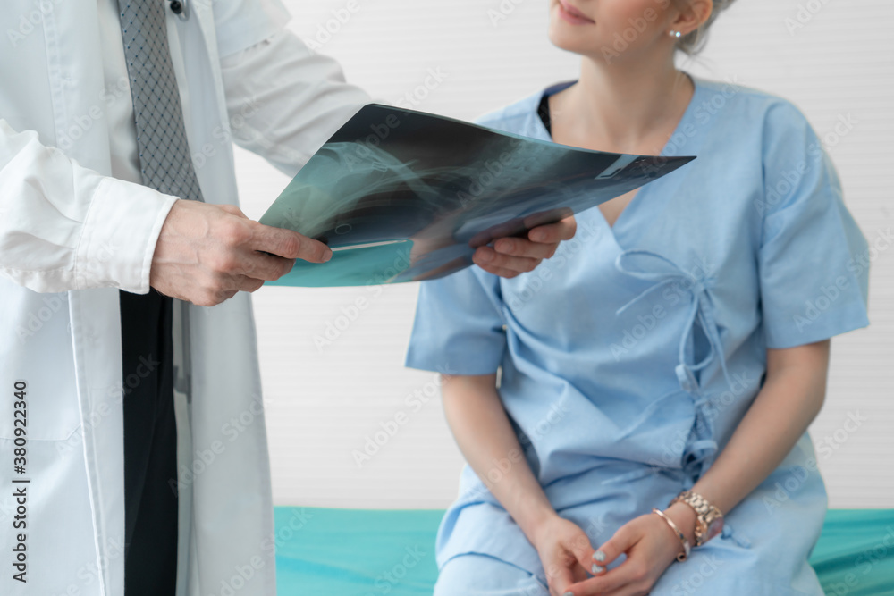 Doctor in professional uniform examining patient at hospital or medical clinic. Health care , medica