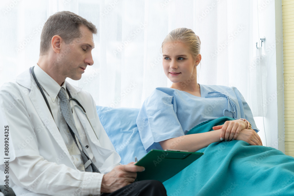 Doctor in professional uniform examining patient at hospital or medical clinic. Health care , medica