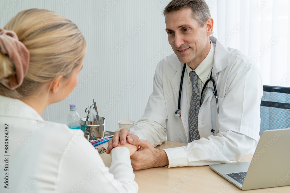 Doctor in professional uniform examining patient at hospital or medical clinic. Health care , medica