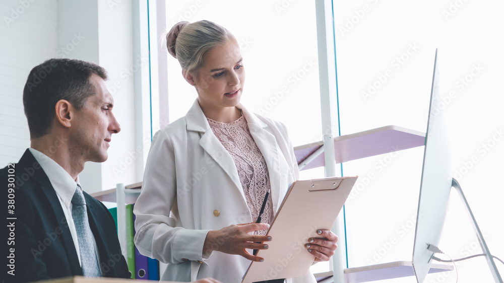 Two business people talk project strategy at office meeting room. Businessman discuss project planni