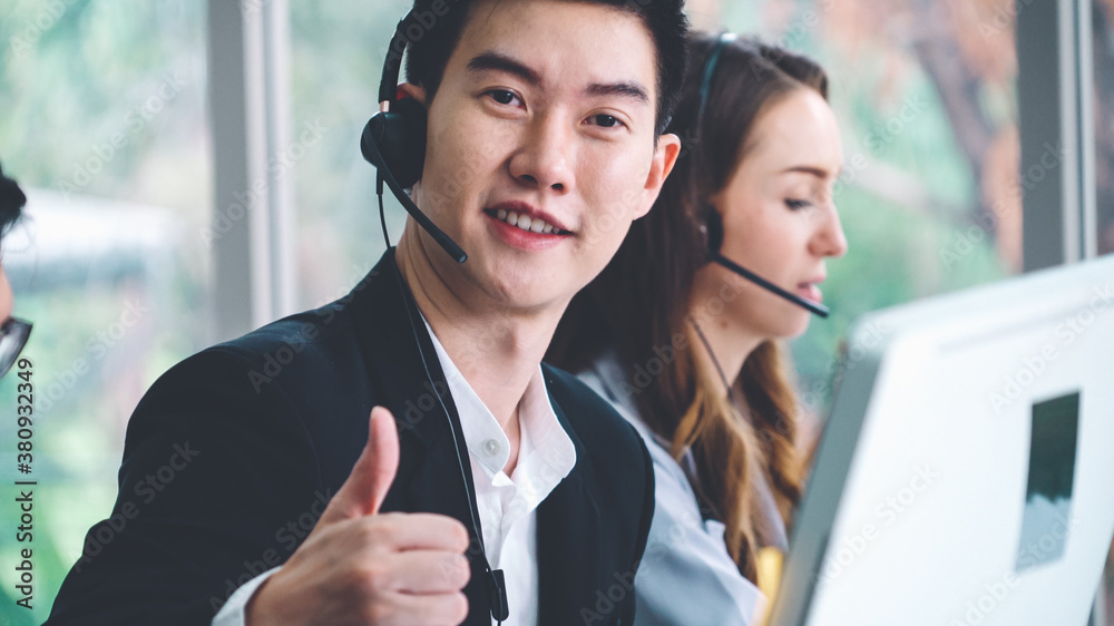 Business people wearing headset working in office to support remote customer or colleague. Call cent