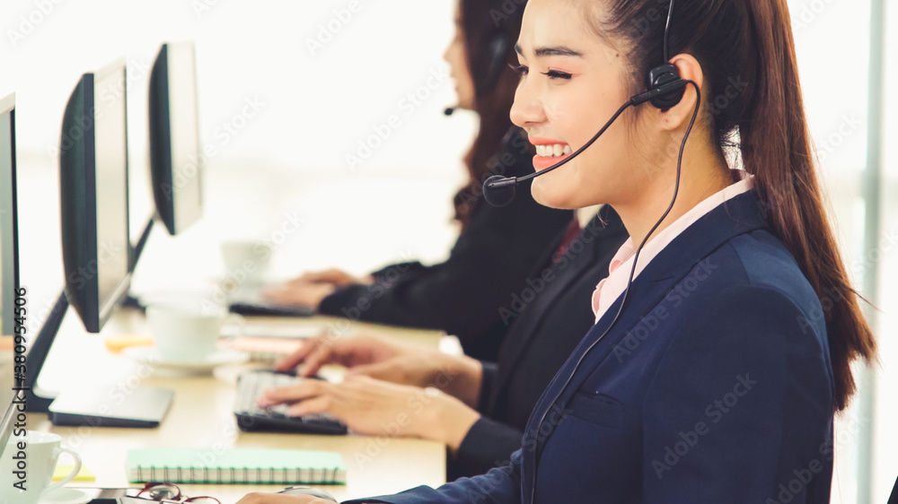 Business people wearing headset working in office to support remote customer or colleague. Call cent