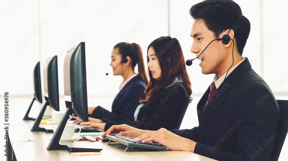 Business people wearing headset working in office to support remote customer or colleague. Call cent