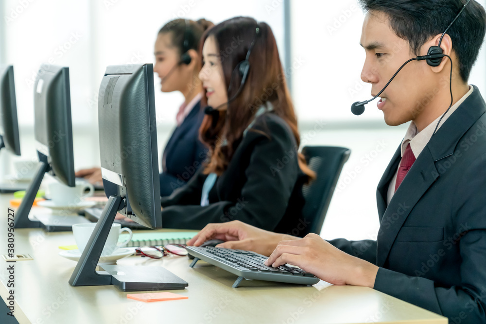 Business people wearing headset working in office to support remote customer or colleague. Call cent