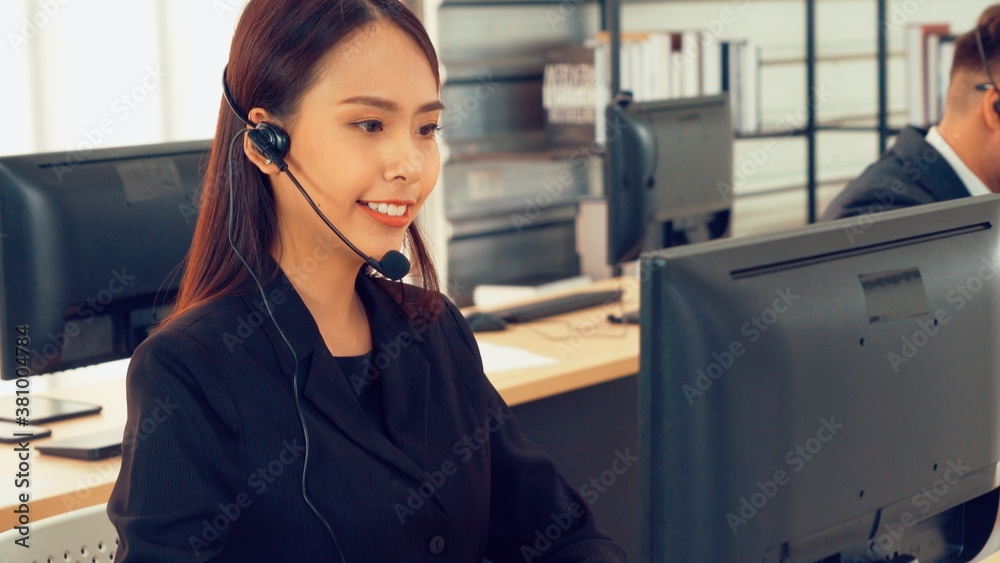 Business people wearing headset working in office to support remote customer or colleague. Call cent