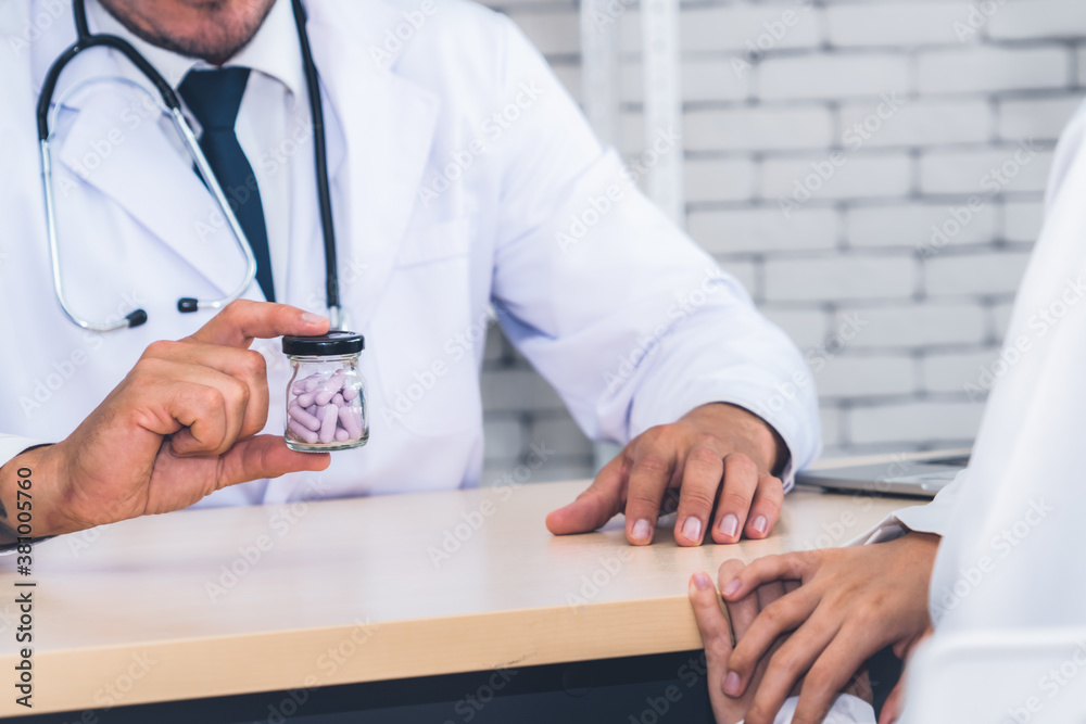 Doctor in professional uniform examining patient at hospital or medical clinic. Health care , medica