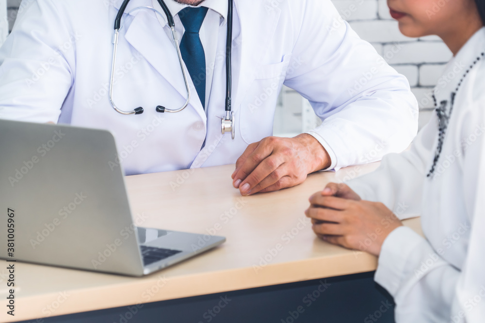 Doctor in professional uniform examining patient at hospital or medical clinic. Health care , medica