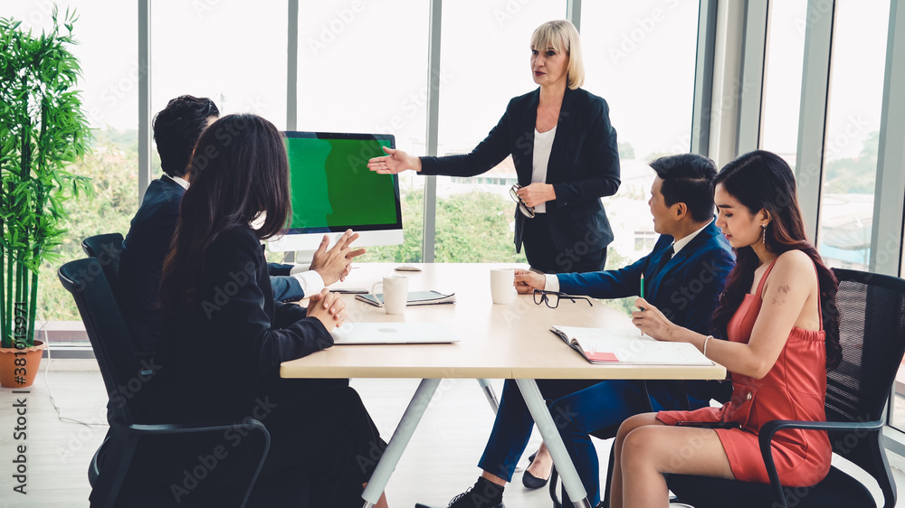 Business people in the conference room with green screen chroma key TV or computer on the office tab