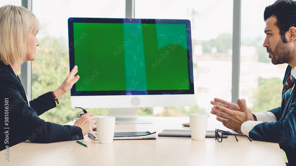 Business people in the conference room with green screen chroma key TV or computer on the office tab