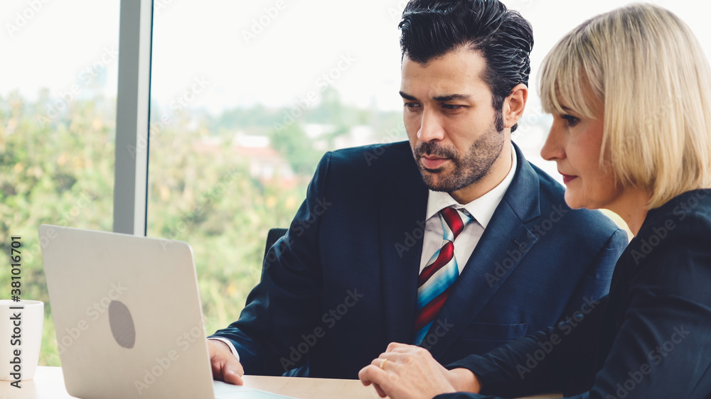 Two business people talk project strategy at office meeting room. Businessman discuss project planni