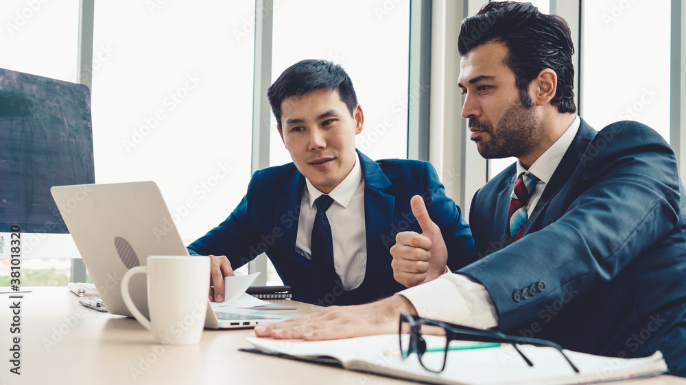 Two business people talk project strategy at office meeting room. Businessman discuss project planni