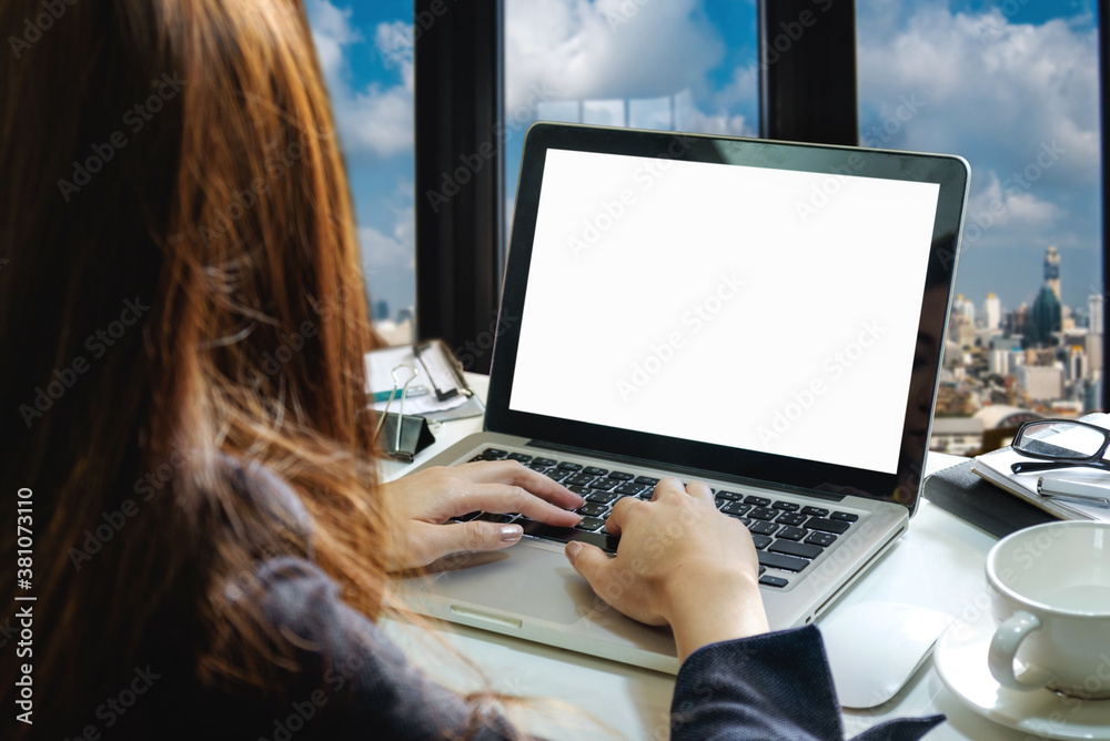 women working laptop and on the white table at home office. 