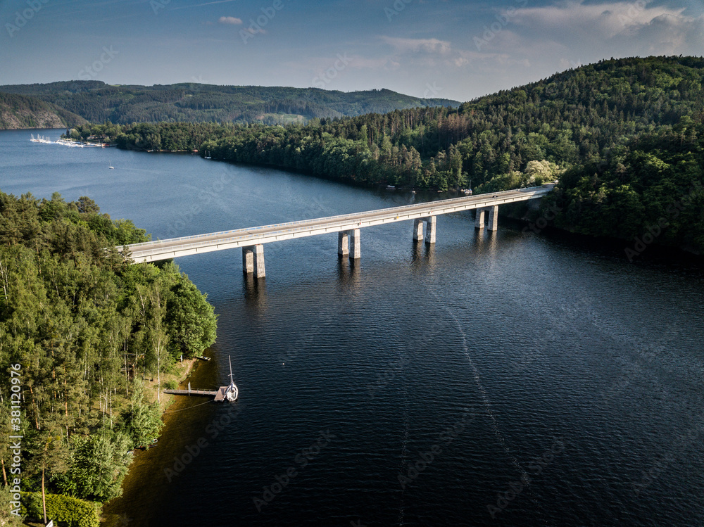 Bridge over lake with yacht club