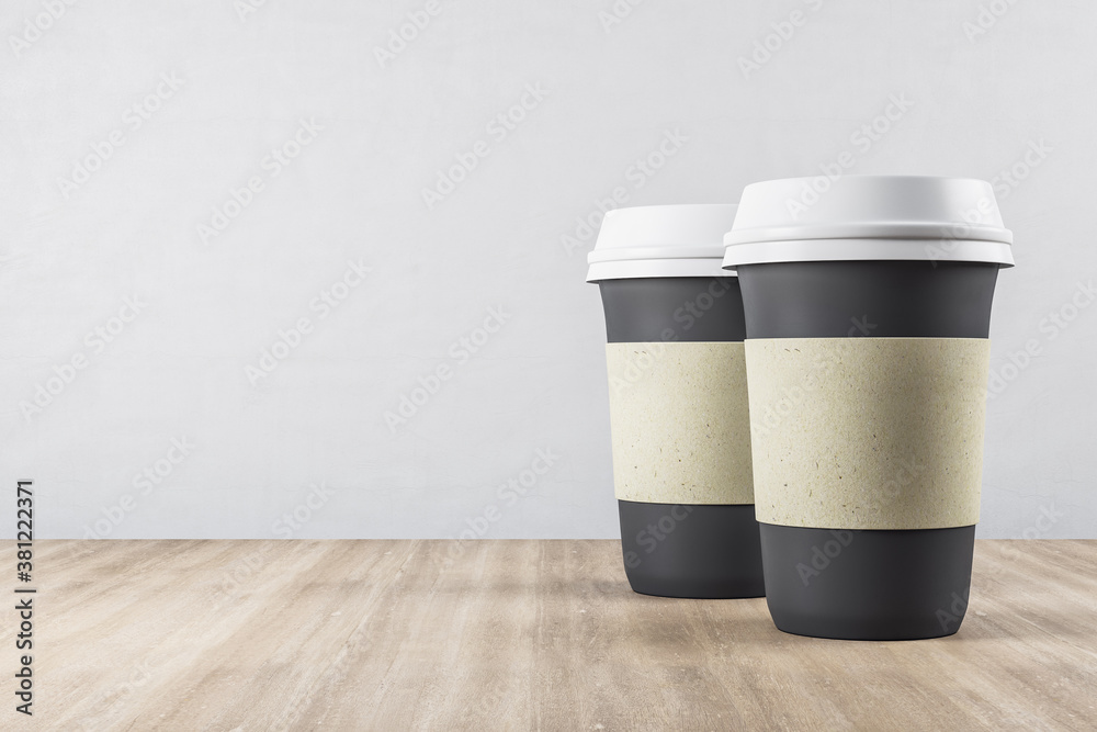 Two disposable black paper cup of coffee