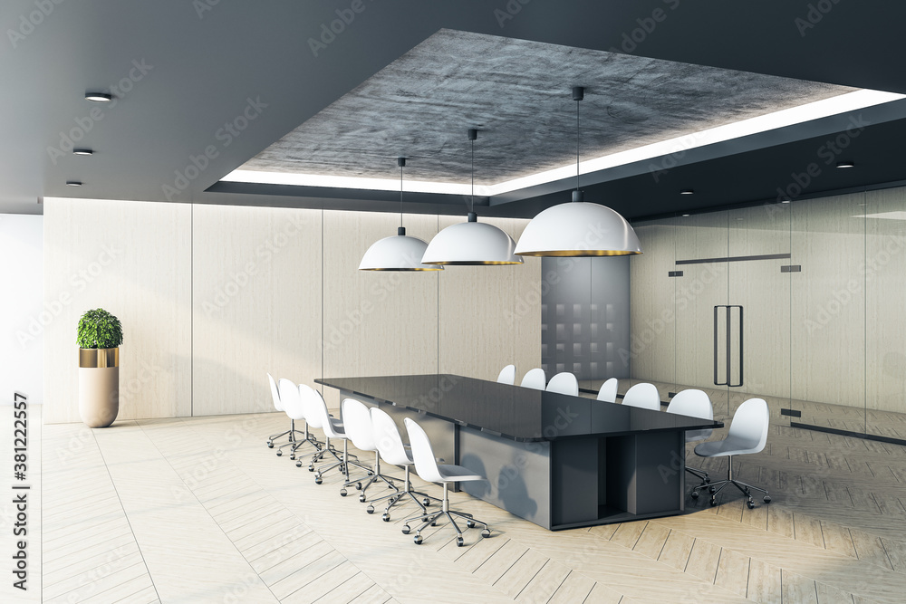 Meeting interior with long conference table and blank wall.