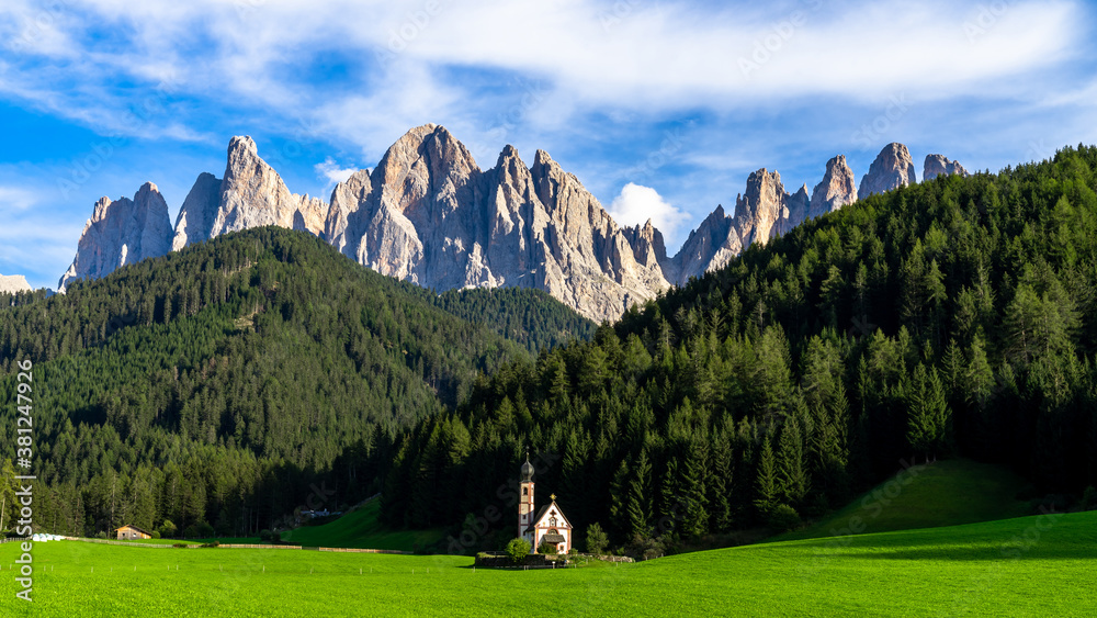 Famouse church in Santa Maddalena village, Village in the Dolomites mountain peaks in St. Magdalena 