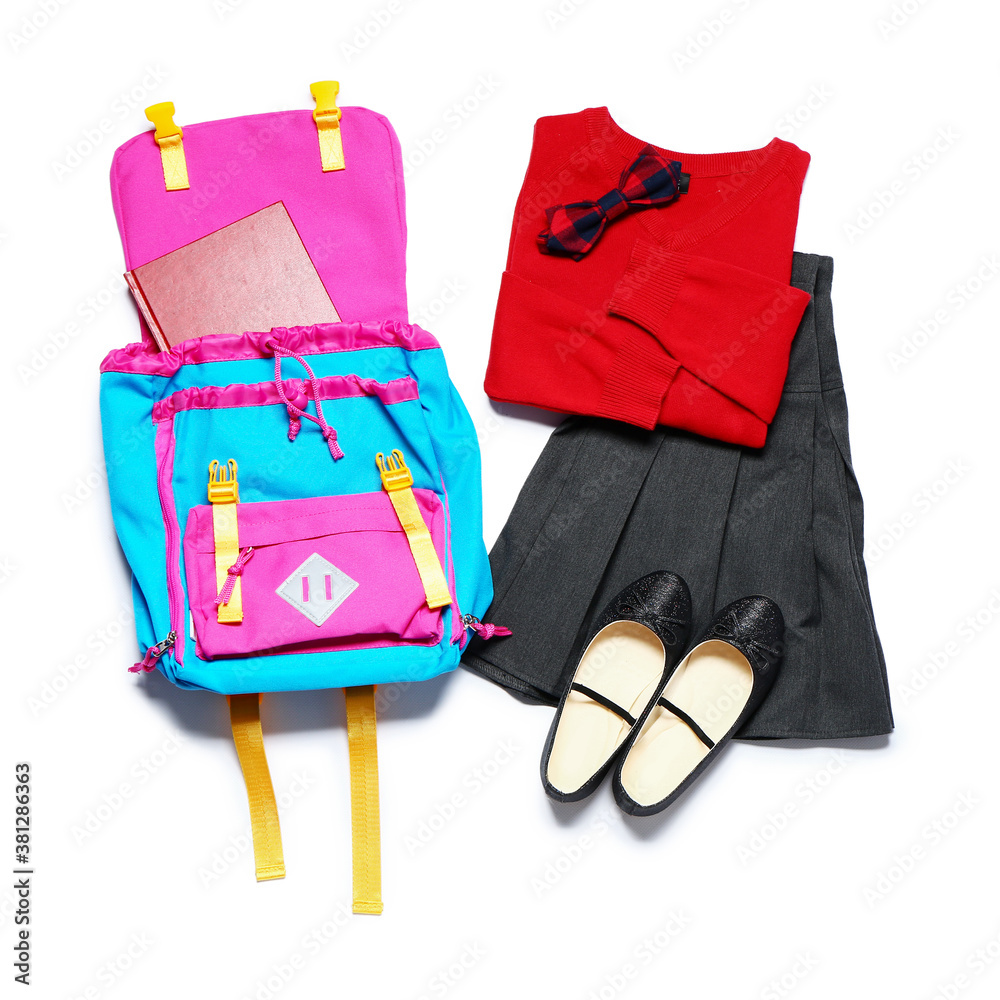 Stylish school uniform with backpack on white background