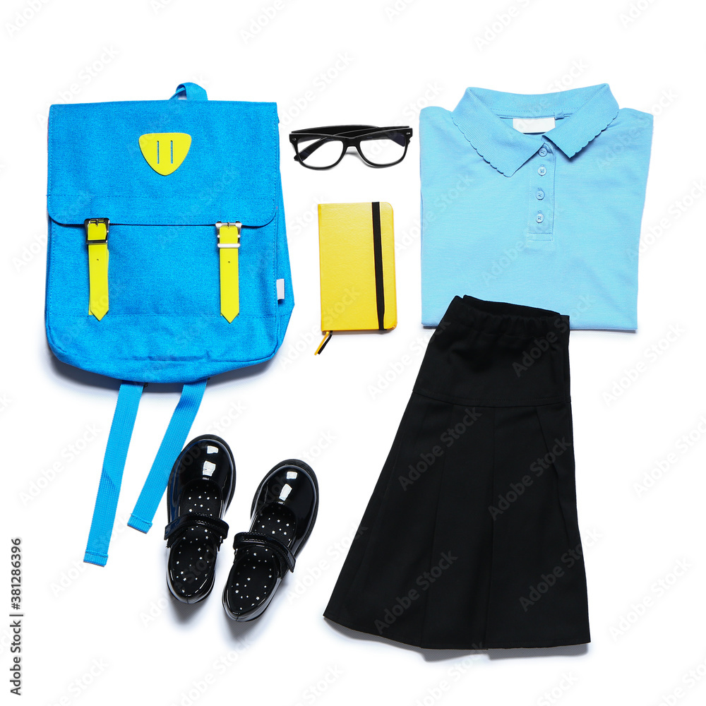 Stylish school uniform with backpack on white background