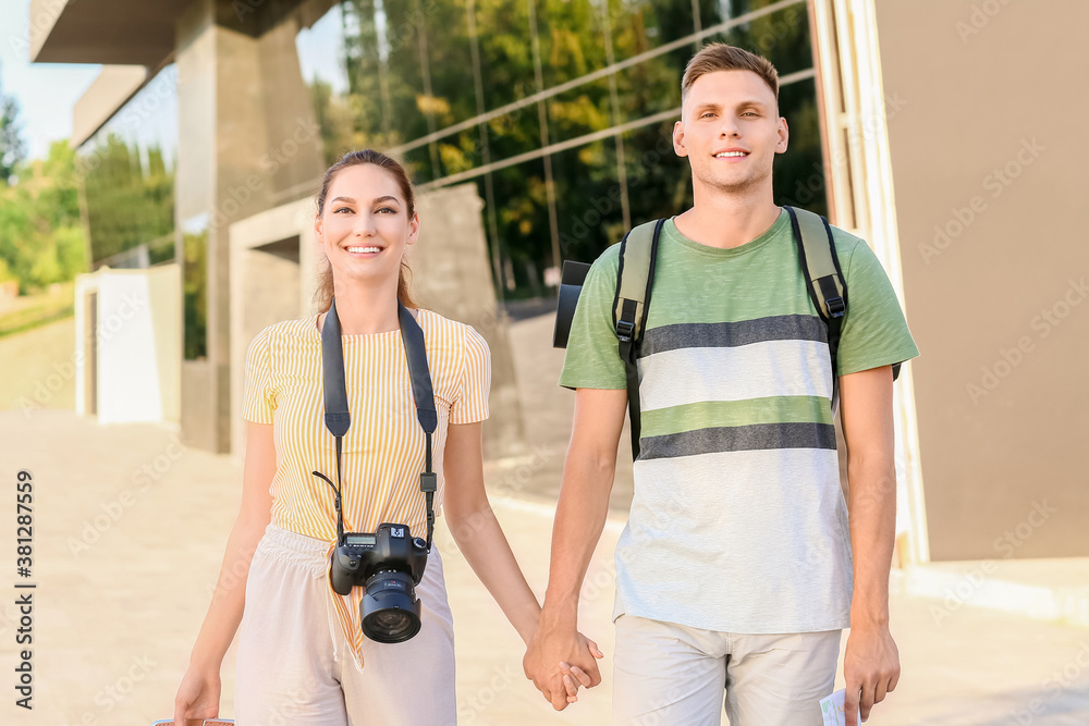 Couple of tourists on city street