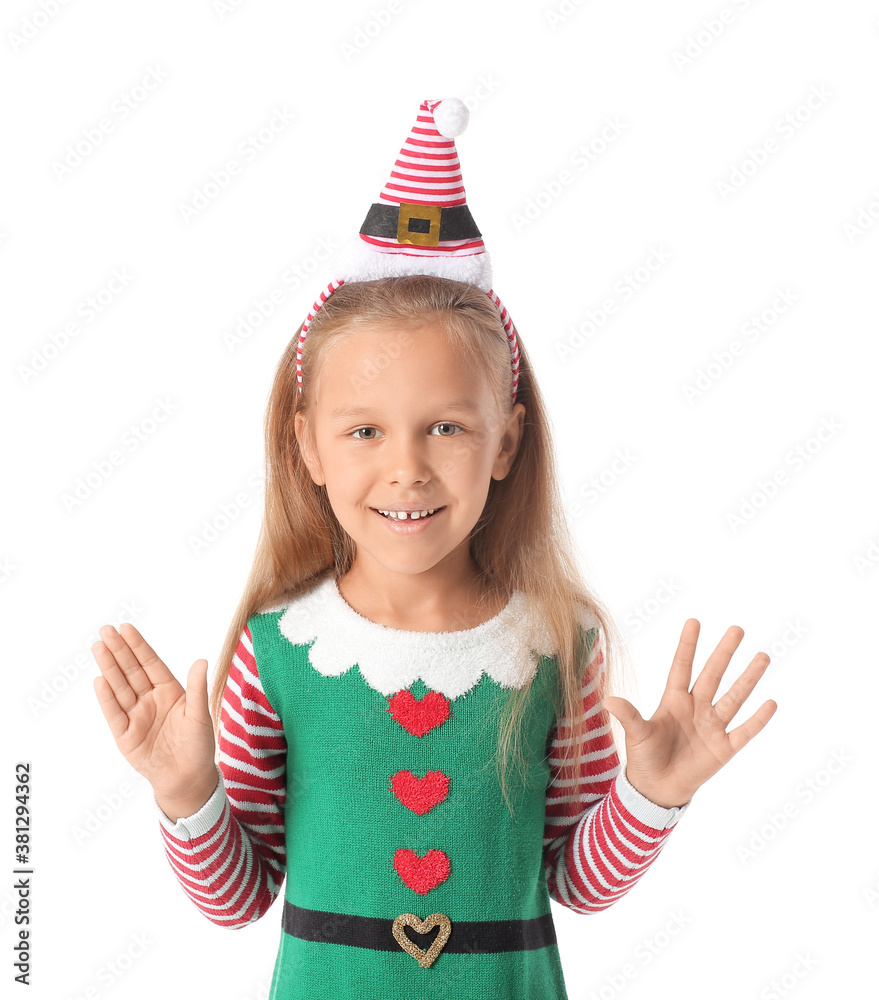 Cute little girl dressed as elf on white background