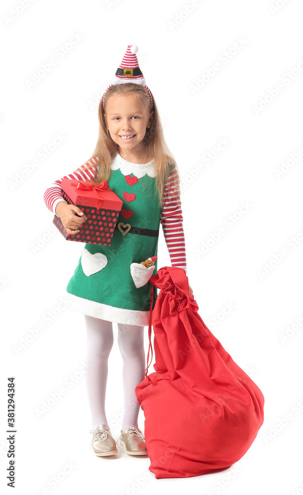 Cute little girl dressed as elf and with Santa Claus bag on white background