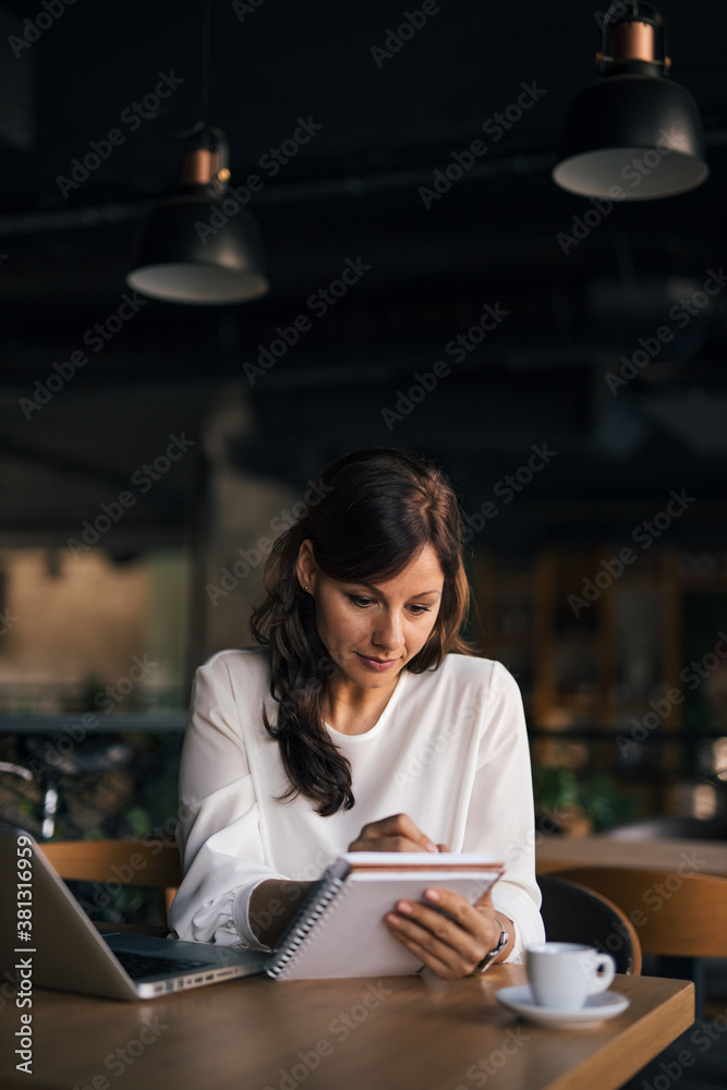 Woman organizes her business.