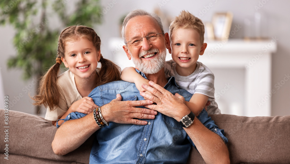 Happy senior woman hug grandkids.