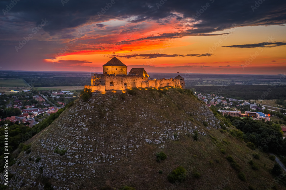 Sumeg, Hungary - Aerial view of the famous illuminated High Castle of Sumeg in Veszprem county at su