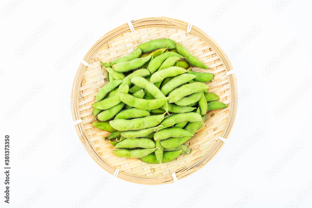 Fresh edamame in a pot on white background