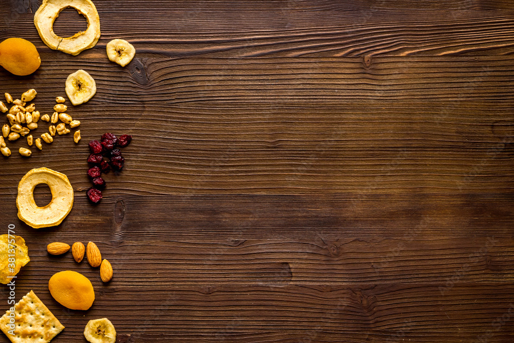 Flat lay of appetizers and snacks overhead. Nuts and dried fruits with crackers