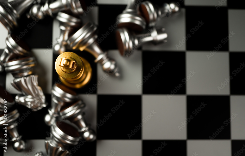 Golden King chess is last standing in the chess board, Concept of successful business leadership