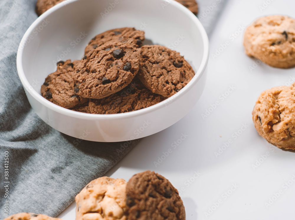 Delicious chocolate cookies placed in a white plate, snack, breakfast.