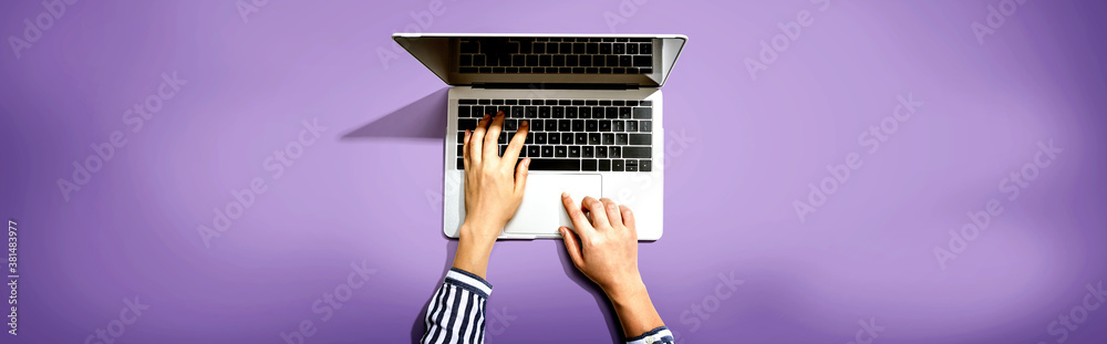 Person using a laptop computer from above