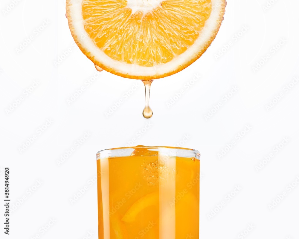 Orange fruit slice dripping fresh juice