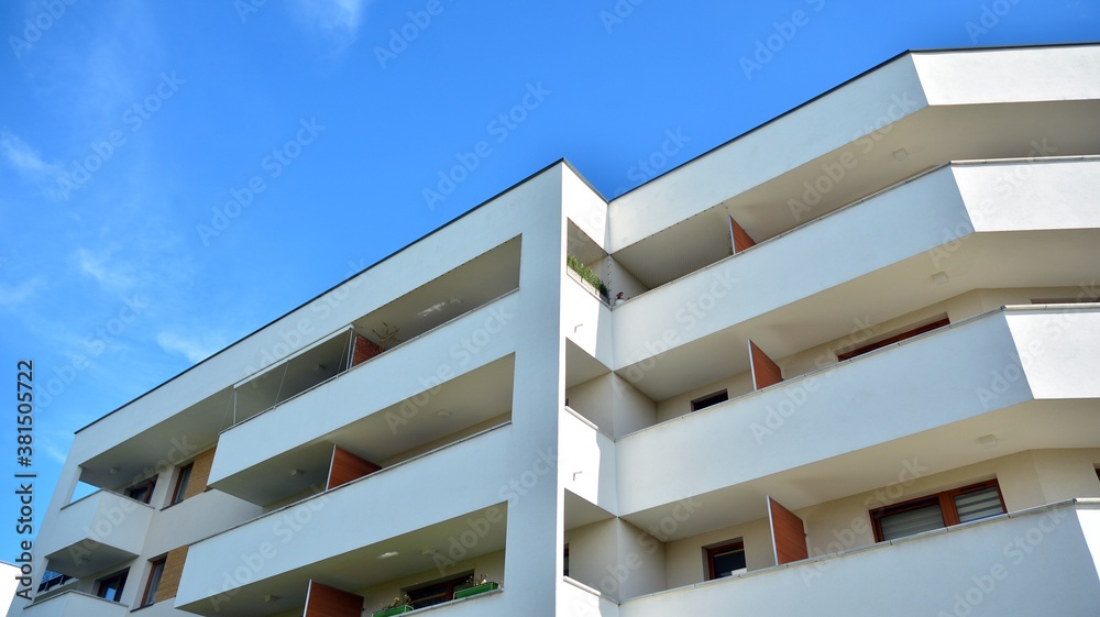 Futuristic square architecture of apartment building for real estate with big windows.