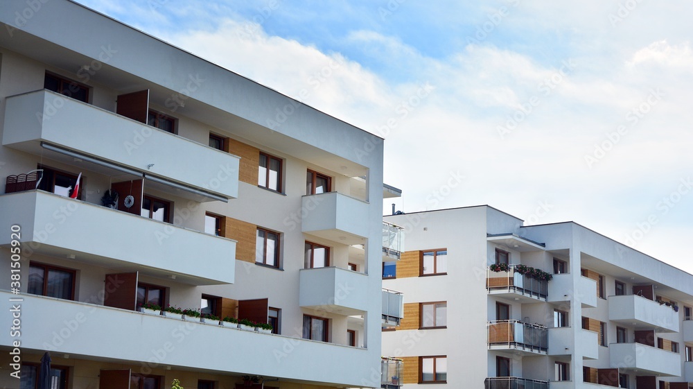 Futuristic square architecture of apartment building for real estate with big windows.