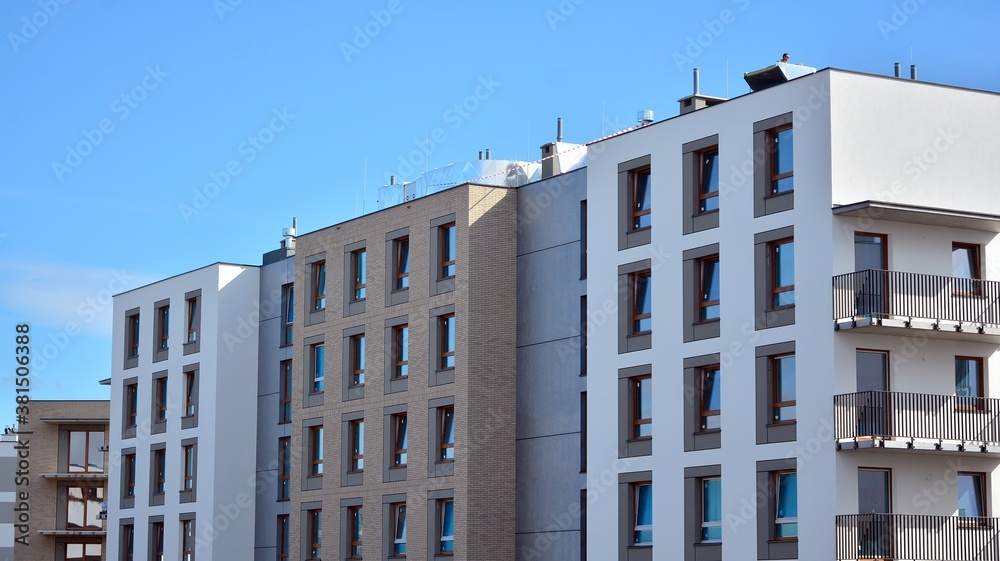 Futuristic square architecture of apartment building for real estate with big windows.