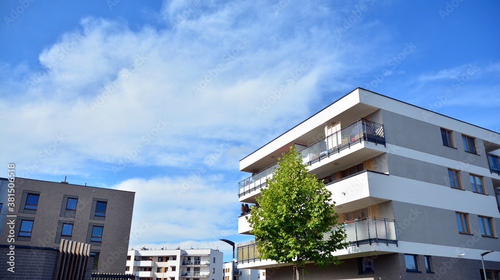 Futuristic square architecture of apartment building for real estate with big windows.